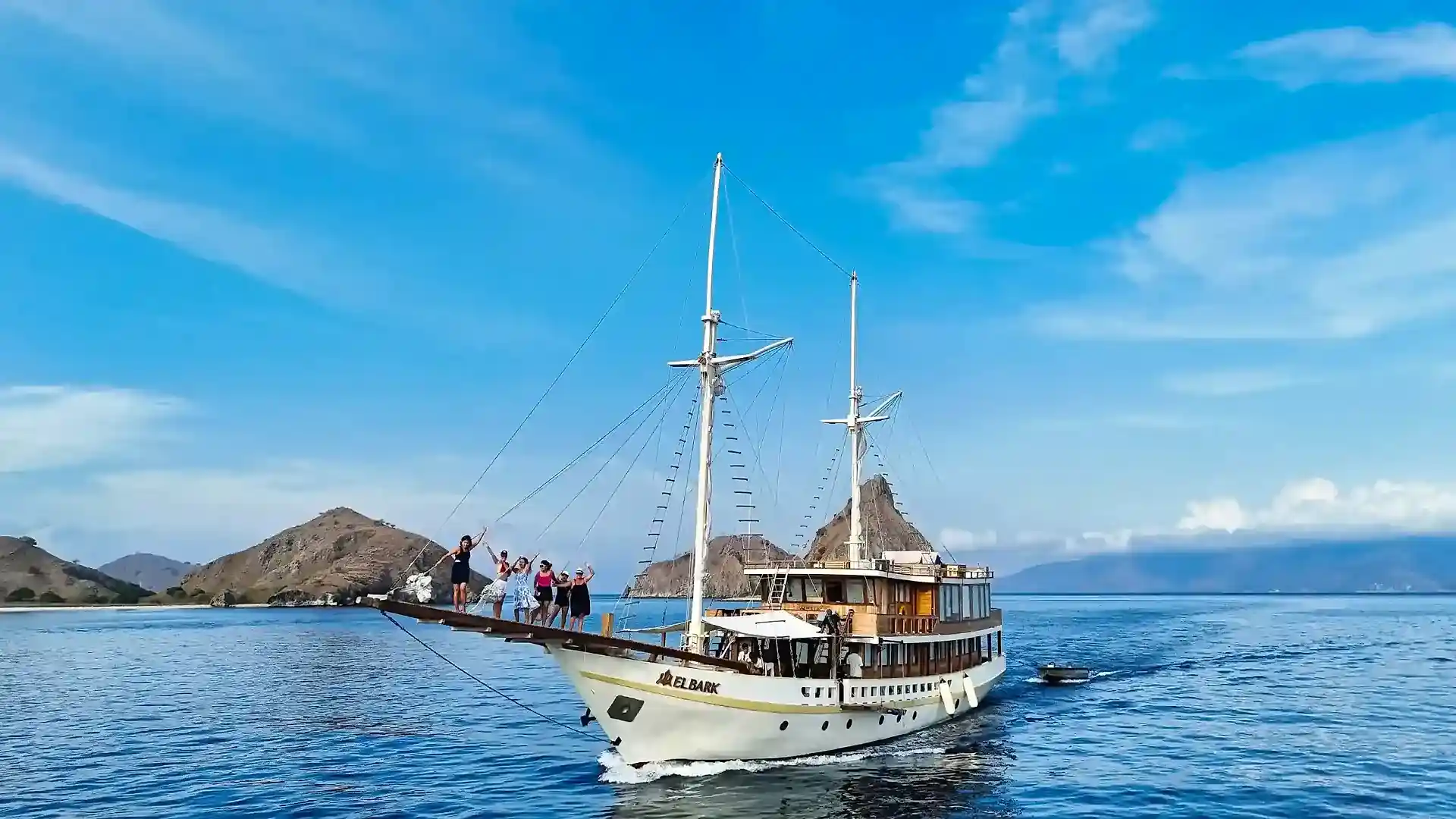 Guests preparing to dive from the tender near a reef